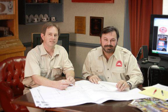 Tom Vesce & Murray Arnott reviewing resort plans.